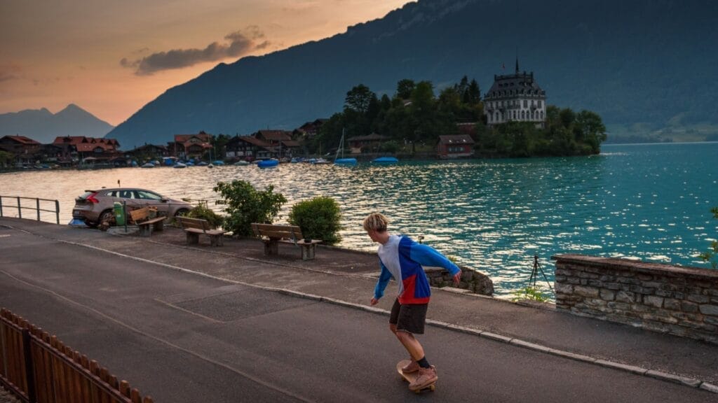 Young-skater-skateboarding-in-Iseltwald-along-the-Lake-Brienz